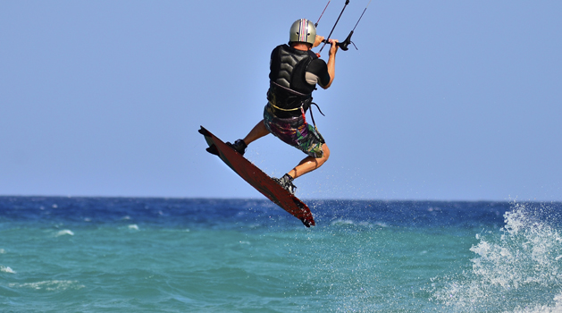 Kitesurfer with helmet  jumping