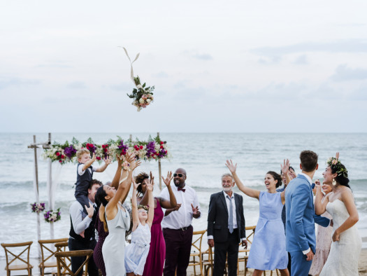 Bride throwing the bouquet at wedding