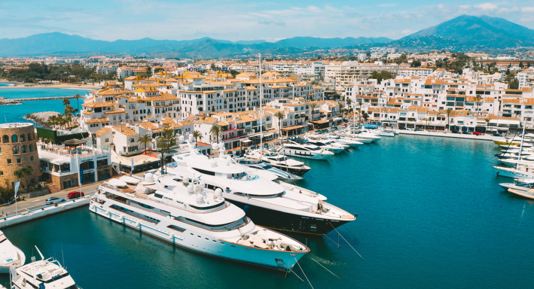 Aerial top view of luxury yachts in Puerto Banus marina, Marbella, Spain.